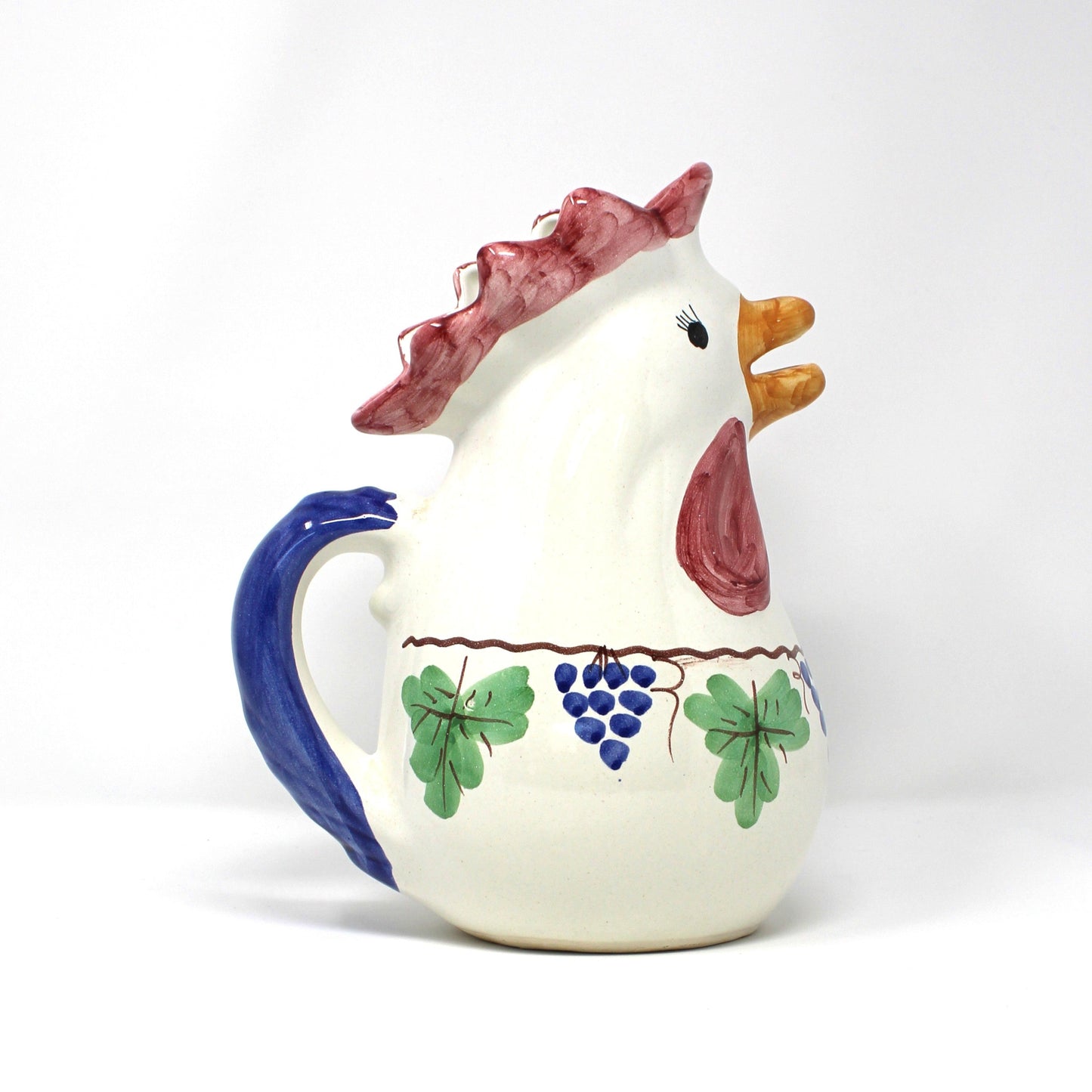 Italian Vietri ceramic rooster-shaped pitcher with a blue handle and grapevine design