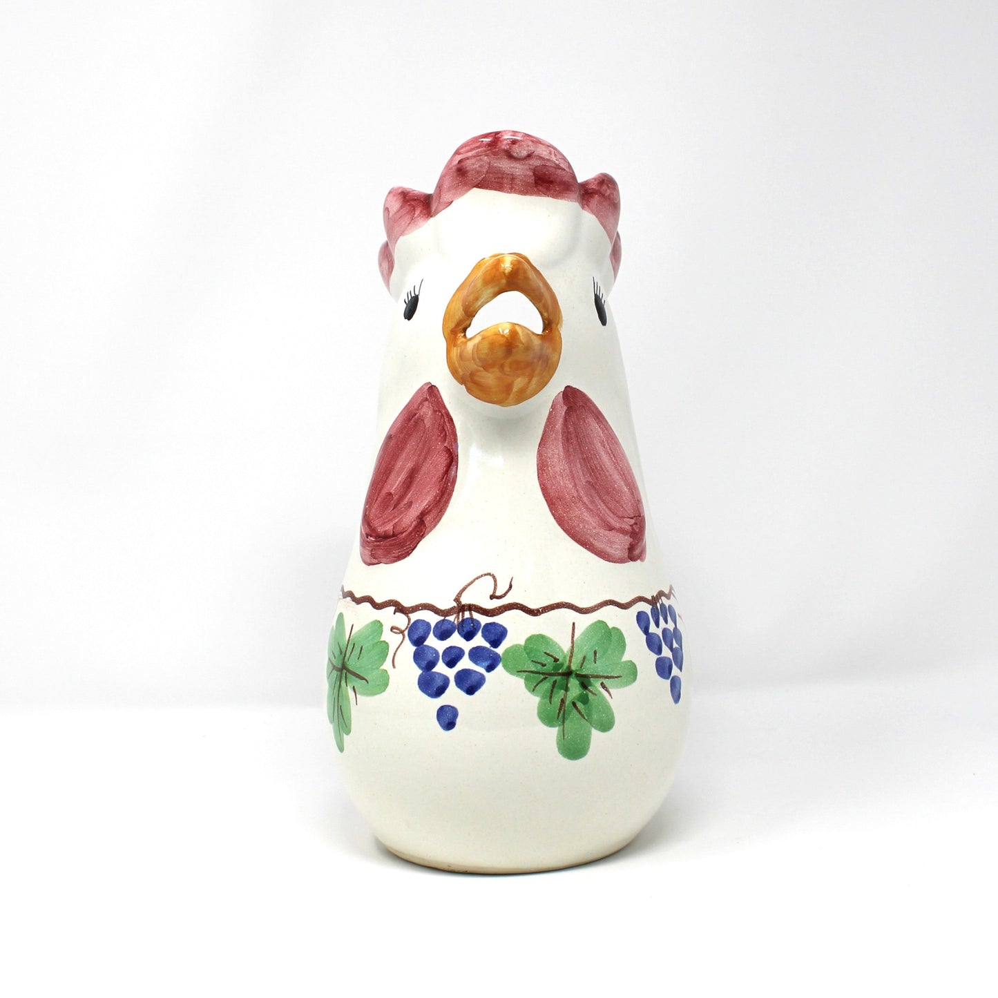 Front view of Italian ceramic rooster-shaped pitcher with colorful grapevine design.