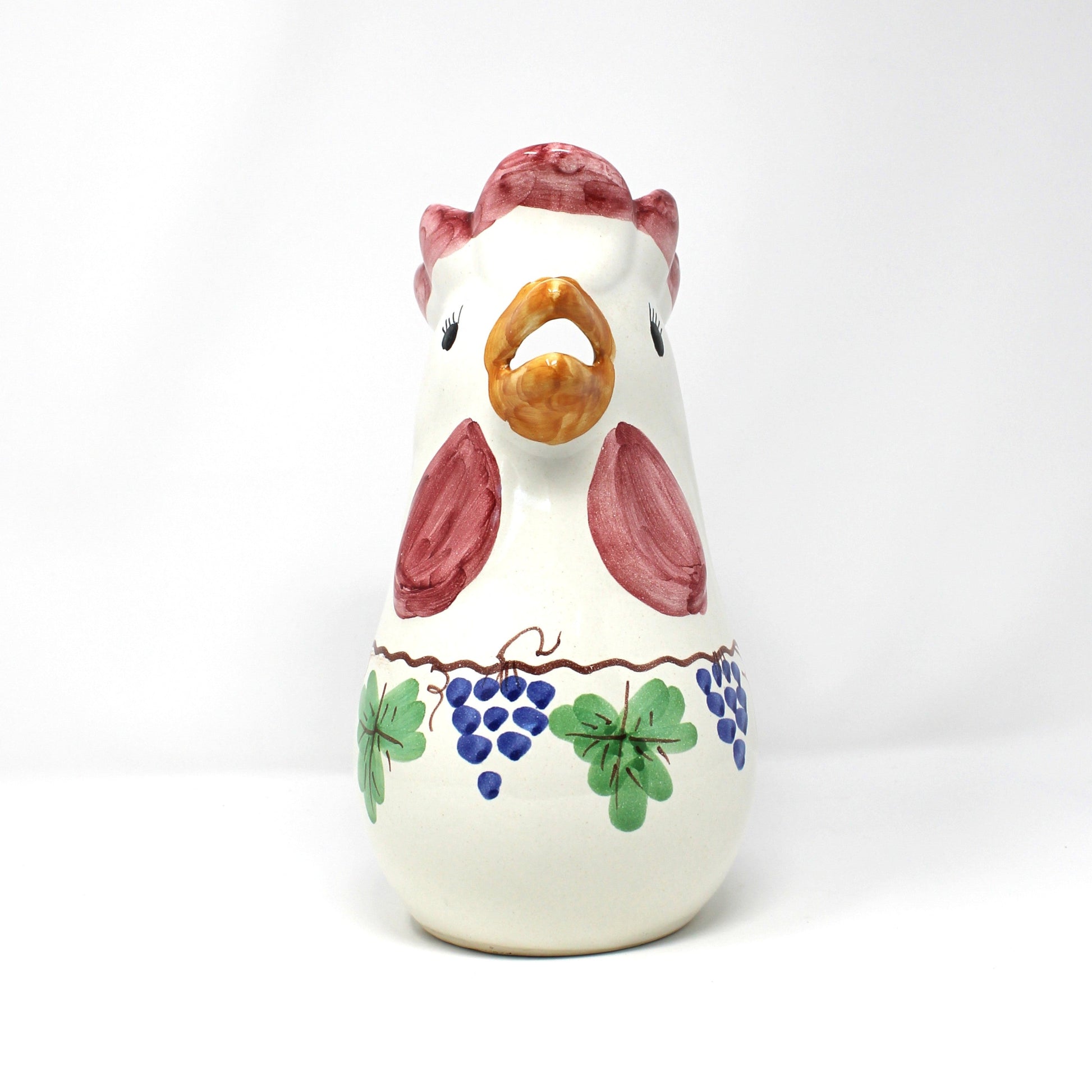 Front view of Italian ceramic rooster-shaped pitcher with colorful grapevine design.