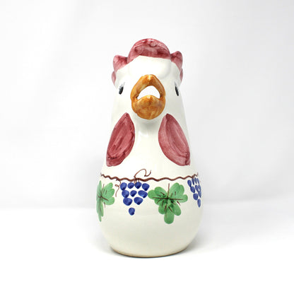 Front view of Italian ceramic rooster-shaped pitcher with colorful grapevine design.