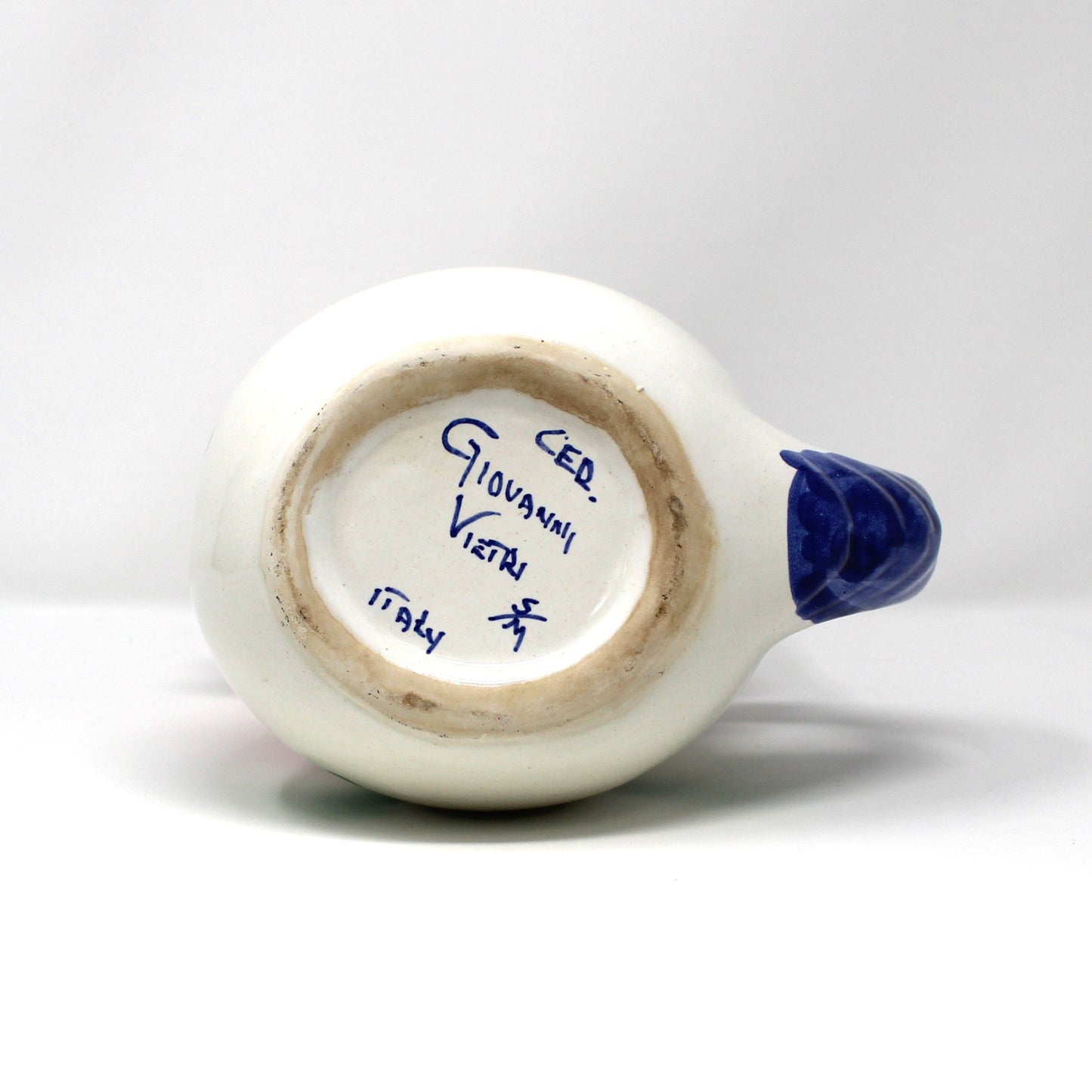 Bottom view of Italian Vietri ceramic rooster shaped pitcher.  With artist mark.  