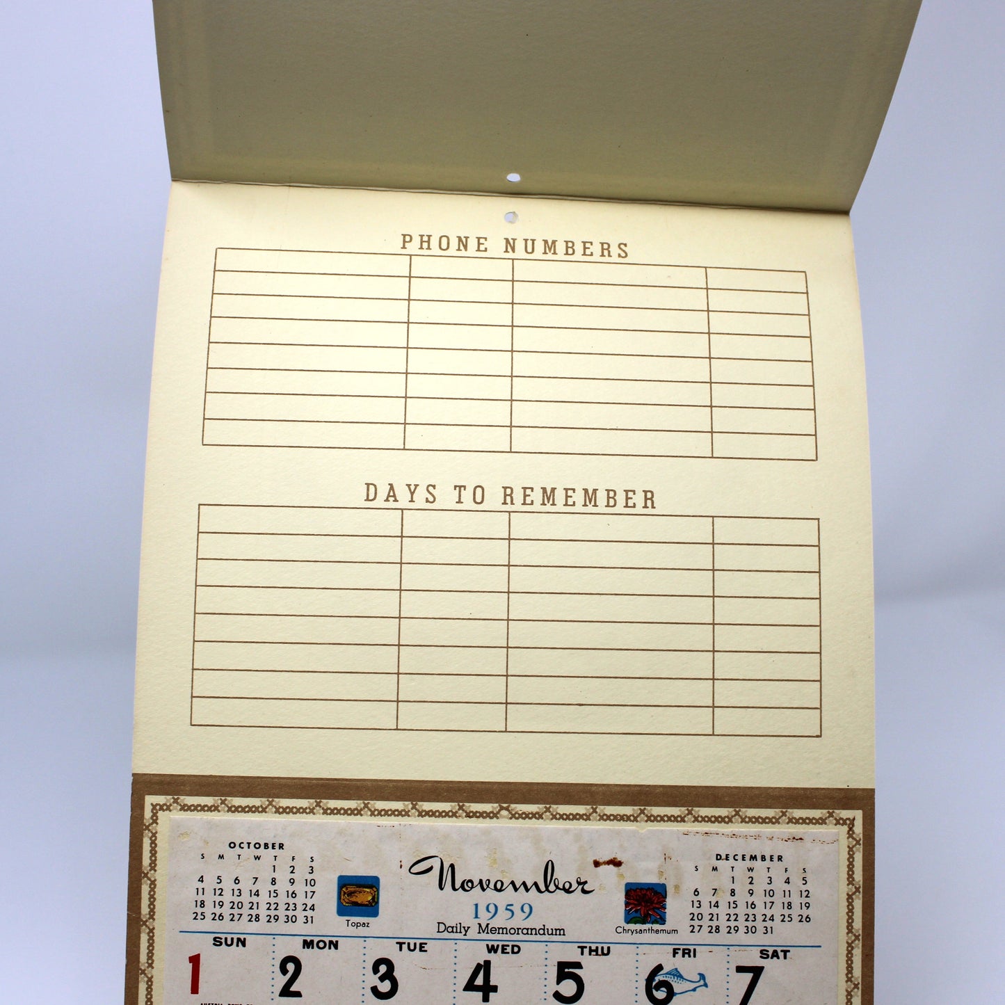 Vintage salesman sample calendar with phone numbers and date boxes. 1959