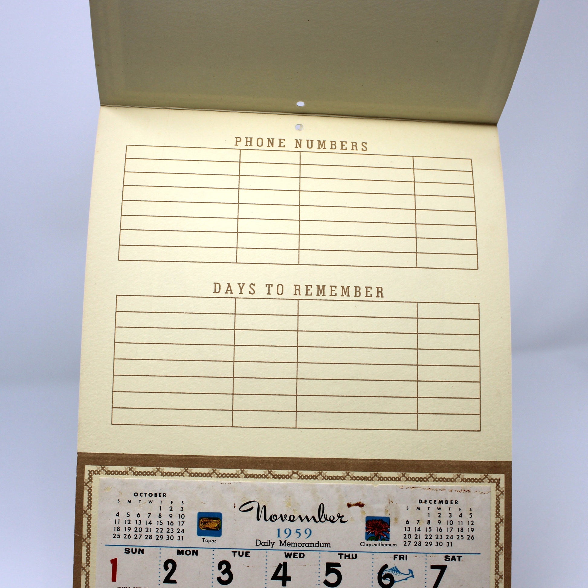 Vintage salesman sample calendar with phone numbers and date boxes. 1959