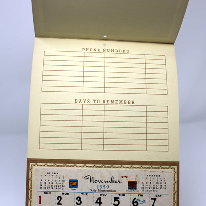 Vintage salesman sample calendar with phone numbers and date boxes. 1959