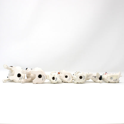 Bottom view of Vintage Disney figurines.  Set of 7 101 Dalmatians dogs.  