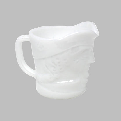 White ceramic pitcher on a white background