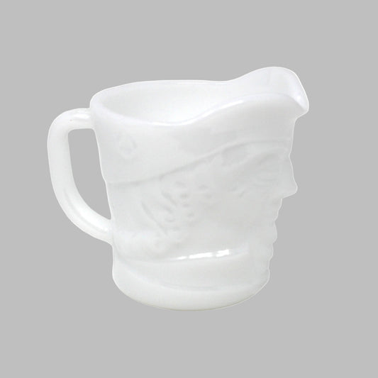 White ceramic pitcher on a white background