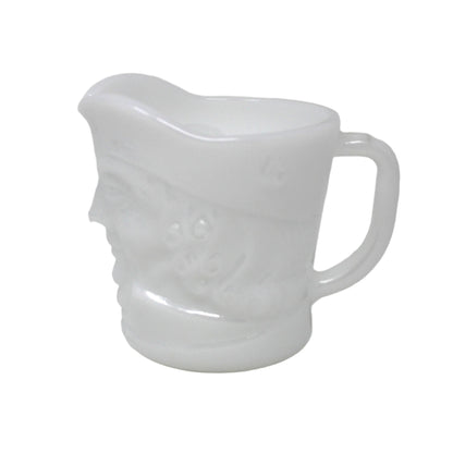 White ceramic pitcher on a white background