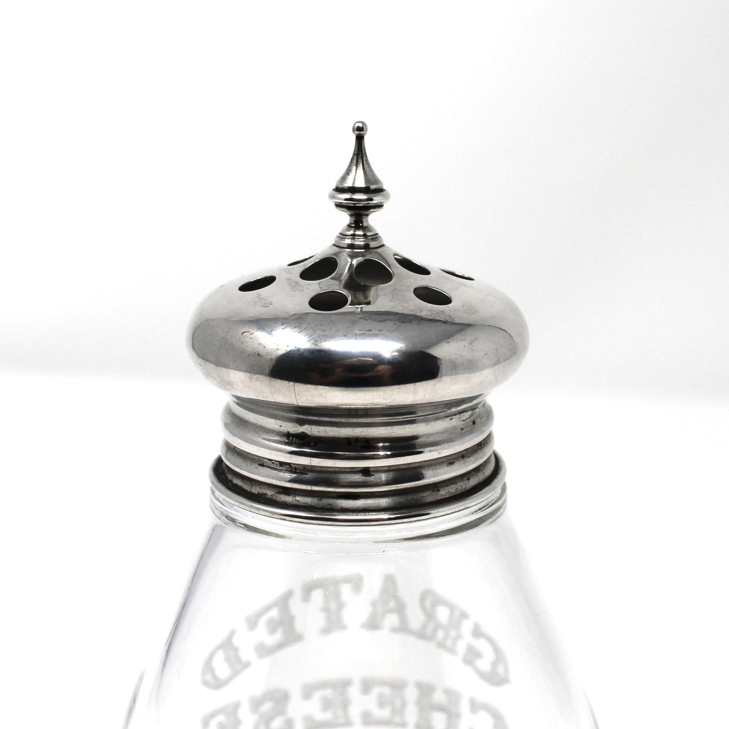 Glass cheese shaker with silver top by F. M. Whiting & Co