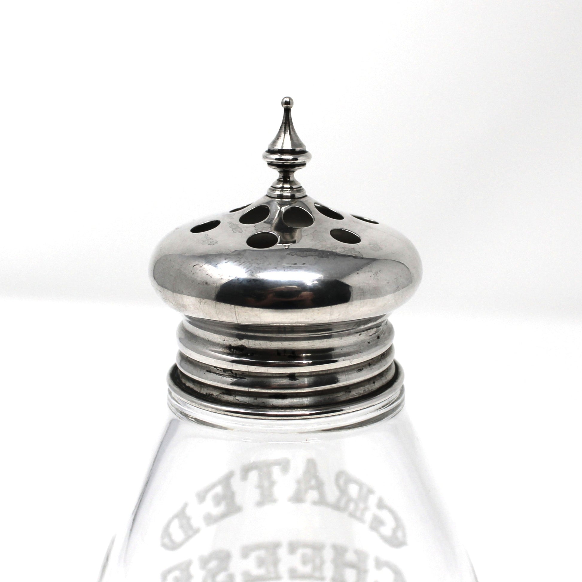 Glass cheese shaker with silver top by F. M. Whiting & Co