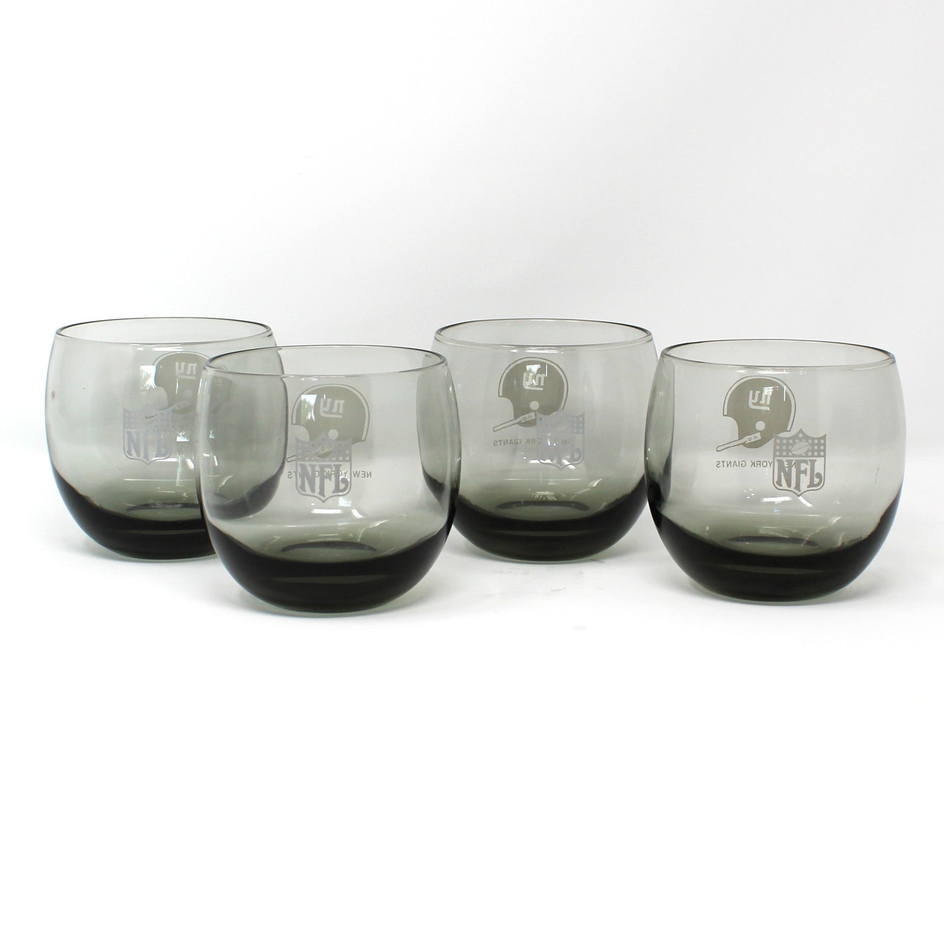 Vintage NFL football New York Giants roly-poly glasses.  Smoke glass, sports barware.