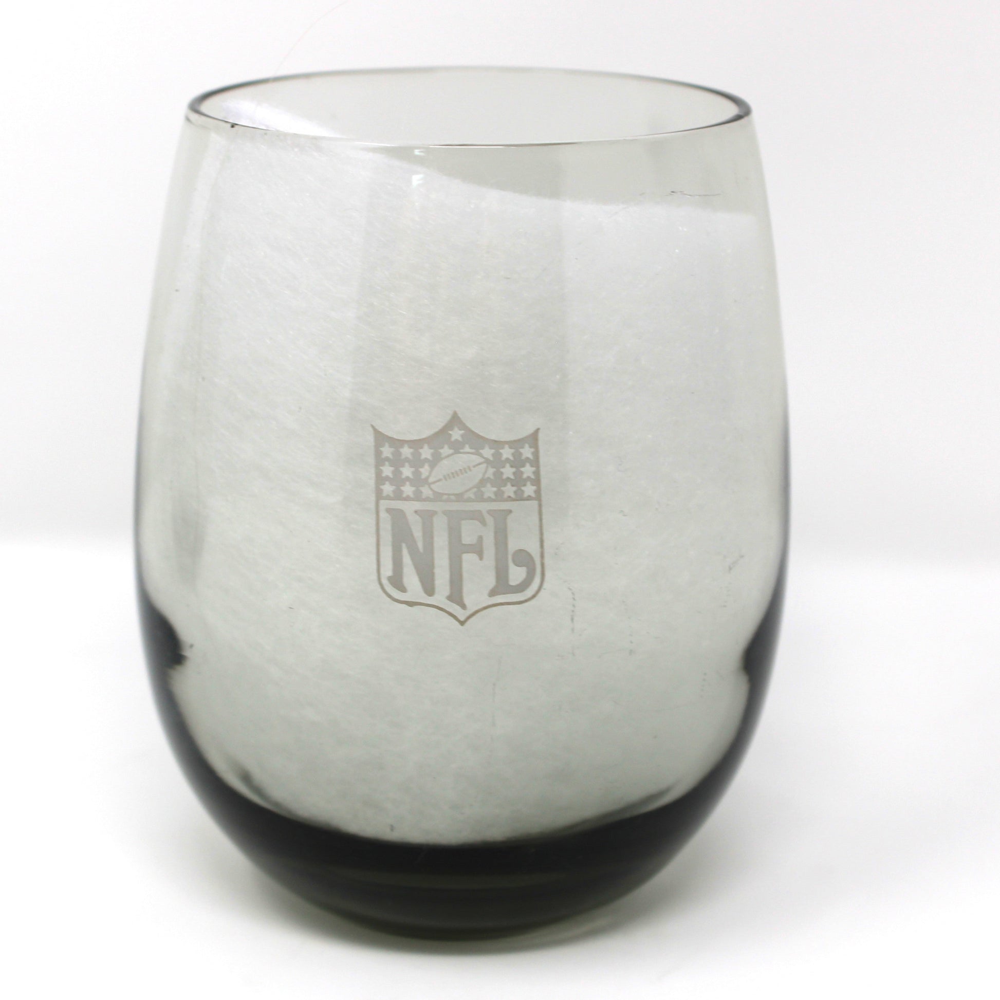 Clear glass with NFL logo on a white background