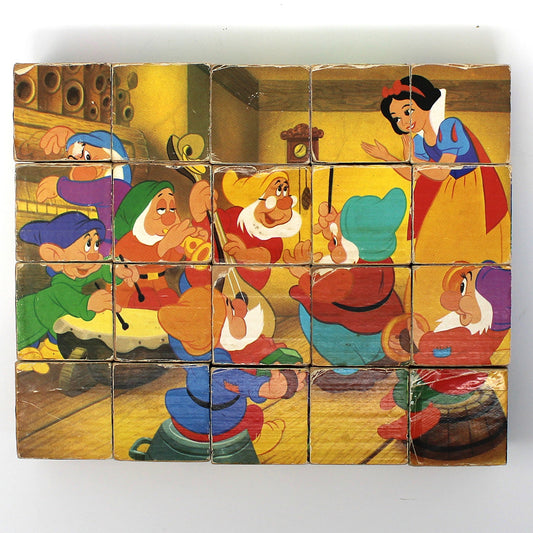 Vintage children's wooden block puzzle with animated Disney characters from 'Snow White and the Seven Dwarfs.