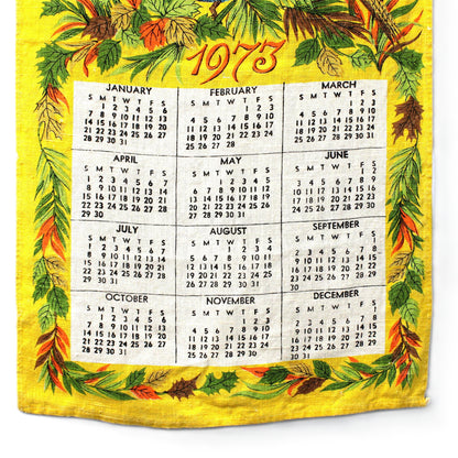 Vintage calendar tea towel for the year 1973 with a colorful pheasants design .