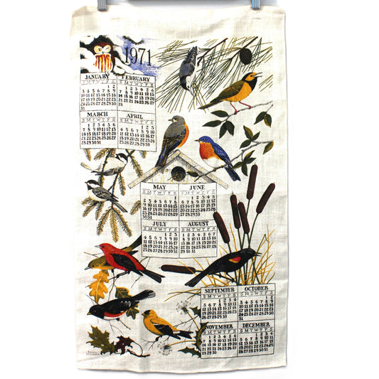 Vintage 1971 Tea towel with bird design and calendar on a white background