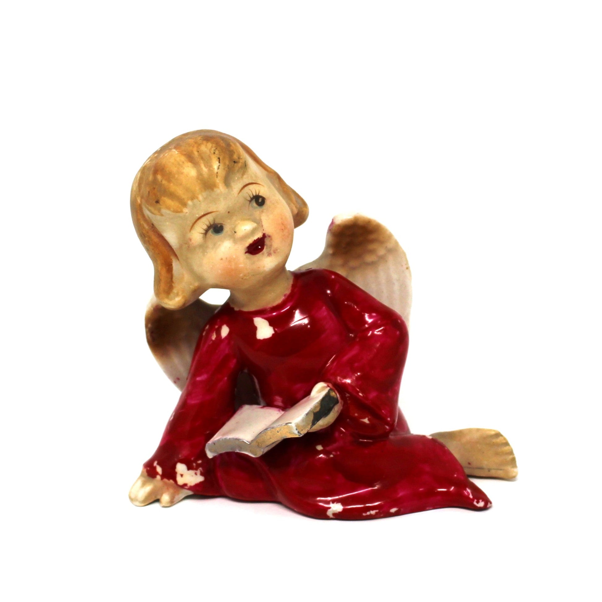 Small vintage Christmas figurine angel in a red dress holding a book.  Lipper & Mann 