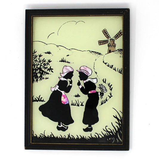 Vintage Framed Silhouette.  Reverse painted glass with foil.  Two Dutch children talking by a windmill.  