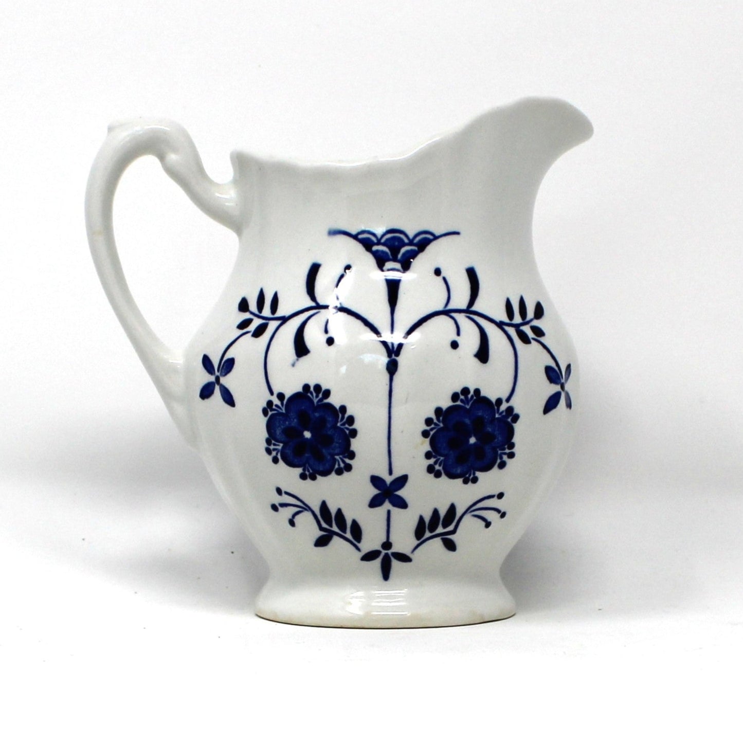 Vintage Ironstone ceramic creamer, J&G Meakin Copenhagen pattern.  Blue and White florals on white background