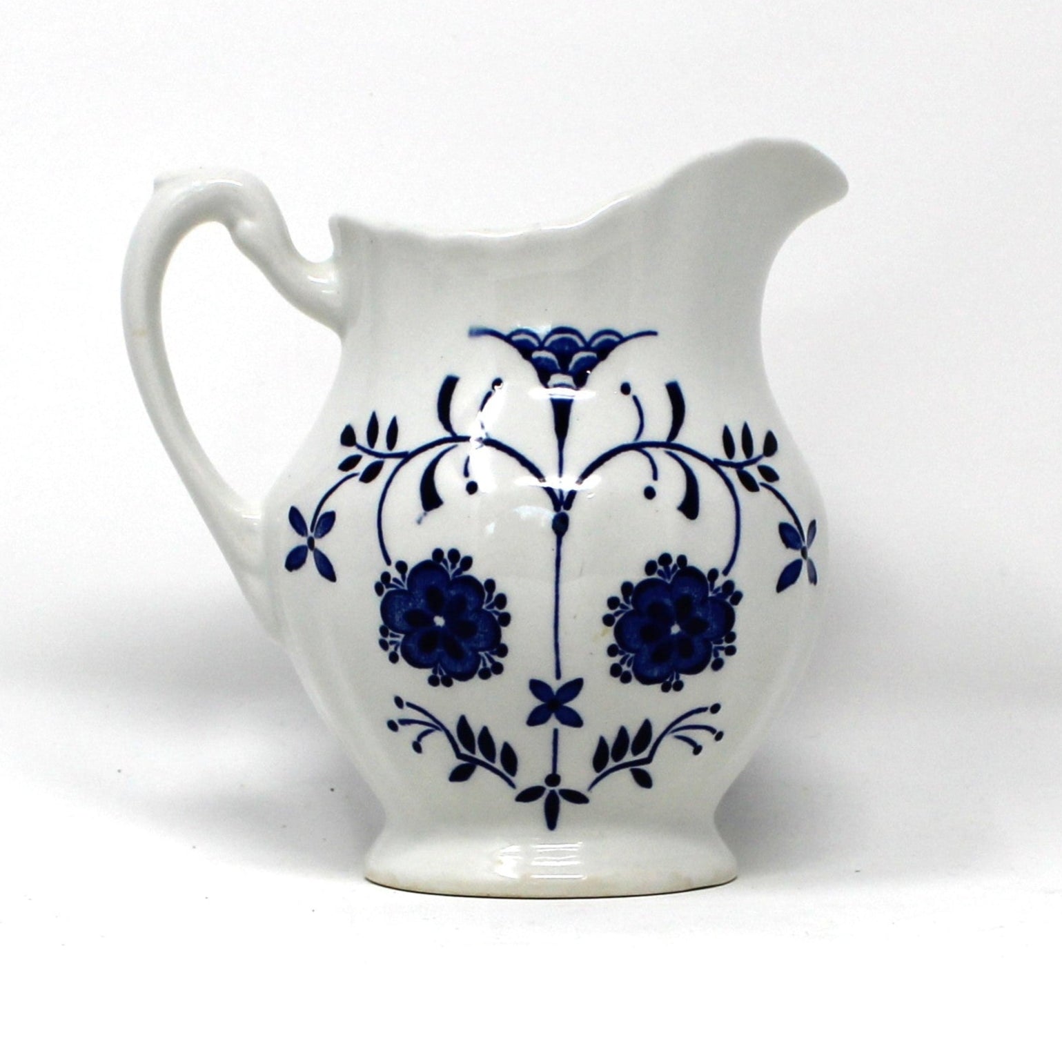 Vintage Ironstone ceramic creamer, J&G Meakin Copenhagen pattern.  Blue and White florals on white background
