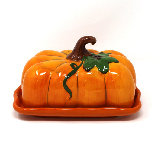 Ceramic butter dish shaped like a pumpkin from Blue Sky Ceramic Works.  Hand crafted and hand painted. Large enough for two sticks of butter.