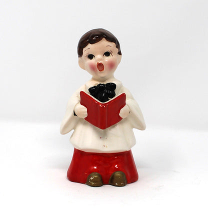 Vintage holiday figurine, ceramic choir boy holding a red hymnal book. Hand Painted Mid Century Japan import.