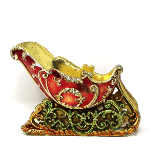 Vintage Decorative sleigh with red, green  and gold colors.
