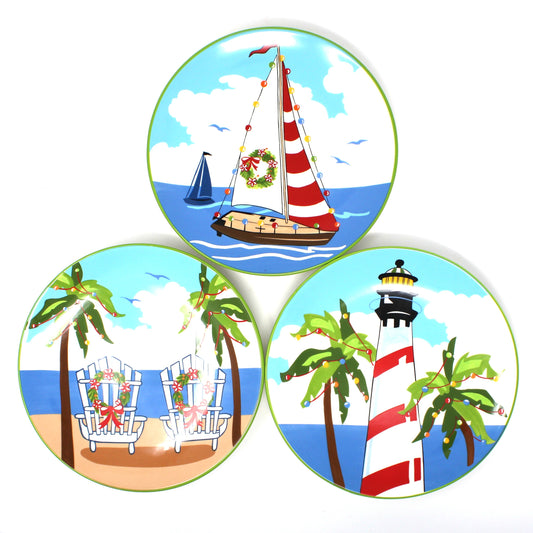 Set of three tropical Christmas plates, featuring a lighthouse, sailboat, and beach scene.  Ceramic Decorative Wall Plates.