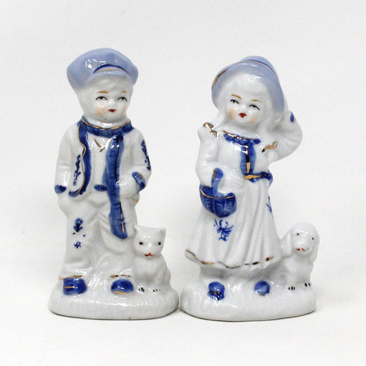 Figurine, Boy and Girl Holding Pets, Blue & White Porcelain, Hand Painted, Vintage Set of 2