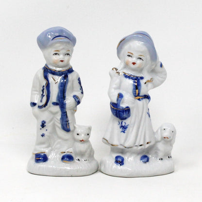 Figurine, Boy and Girl Holding Pets, Blue & White Porcelain, Hand Painted, Vintage Set of 2