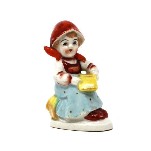 Vintage Figurine, Girl Reading Sitting on Haystack, excellent condition. Made in Occupied Japan circa 1945 - 1952. Hand painted porcelain collectible home decor