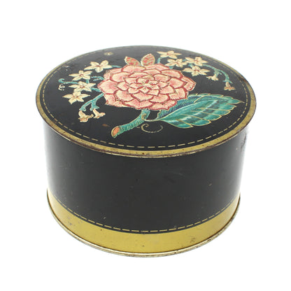 Vintage Powder Tin, Decorative Art Deco Floral Tin on black background. Avon Jasmine Dusting Powder now empty.  Advertising Collectible.