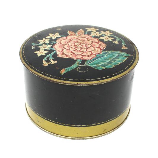 Vintage Powder Tin, Decorative Art Deco Floral Tin on black background. Avon Jasmine Dusting Powder now empty.  Advertising Collectible.