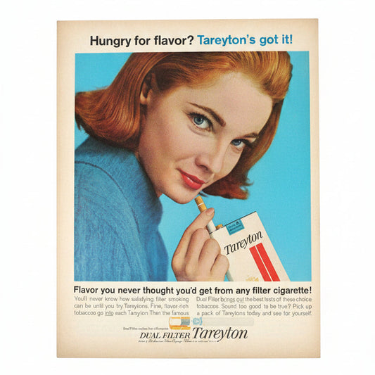 Vintage Tareyton cigarette advertisement featuring a woman with red hair holding a pack of cigarettes.