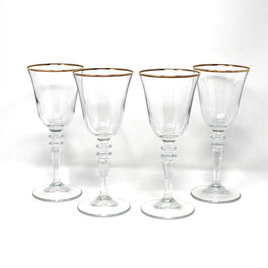 Set of Four vintage clear wine glasses with tiered stems and gold rims 