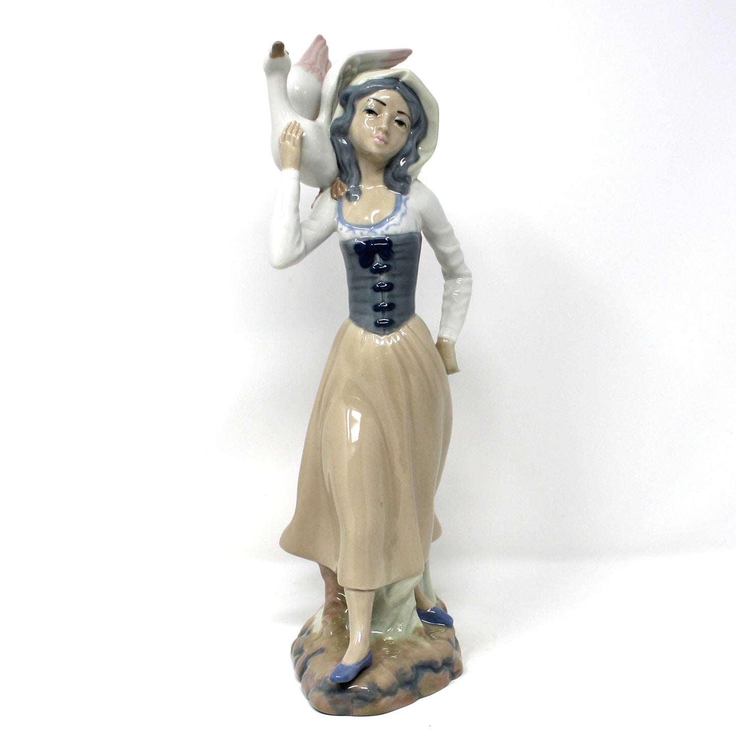Vintage Casades Porcelain sculpture.  Woman holding a goose.  