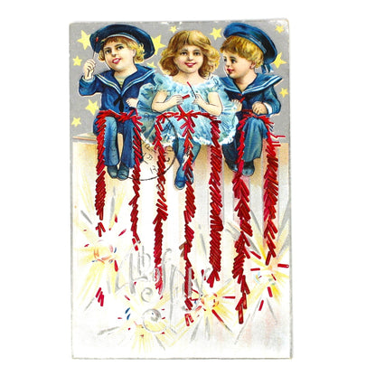 Original antique postcard.  Patriotic 4th of July  illustration of three children with firecrackers.  Embossed and Metallic Ephemera.