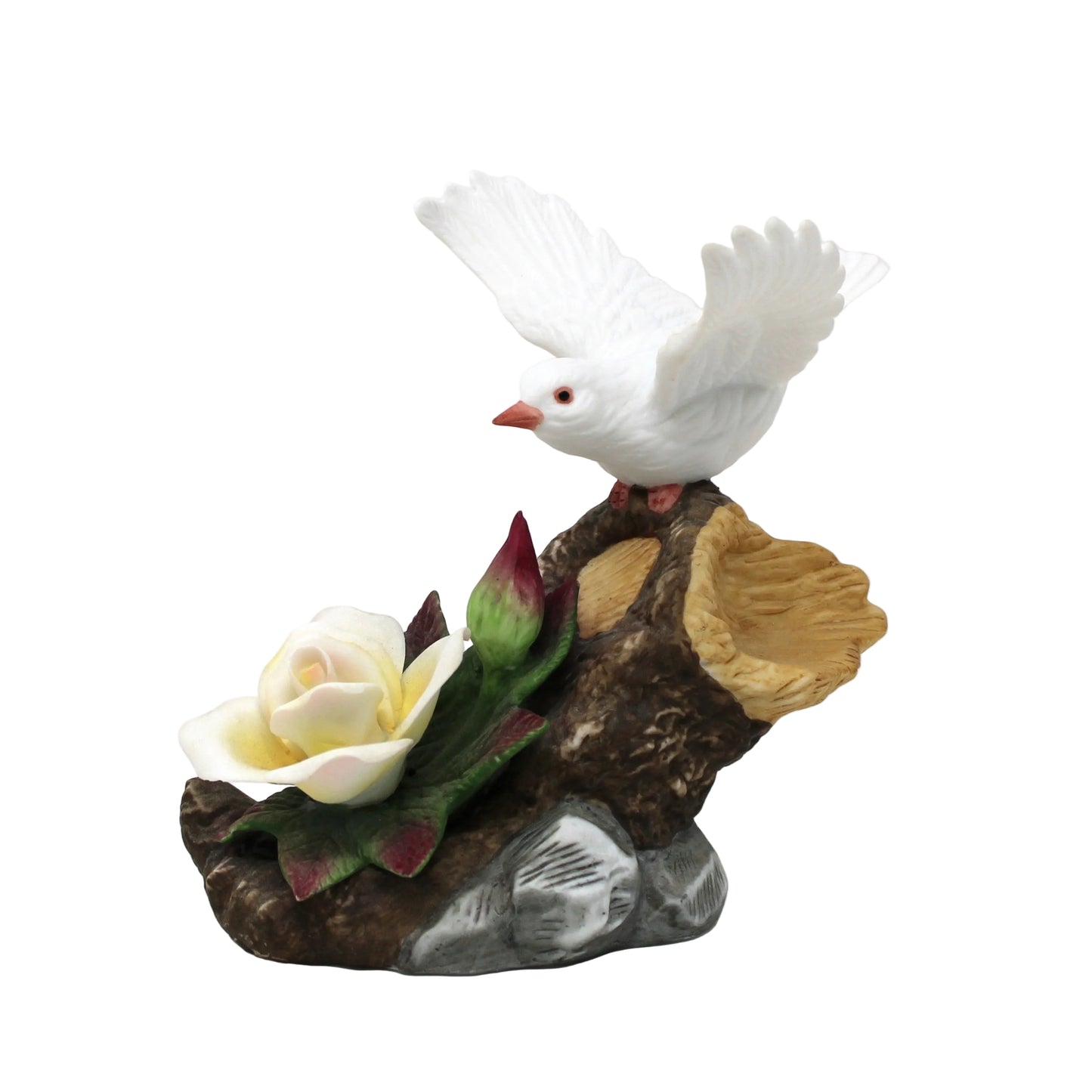 Decorative vintage figurine of a white dove on a branch with flowers 