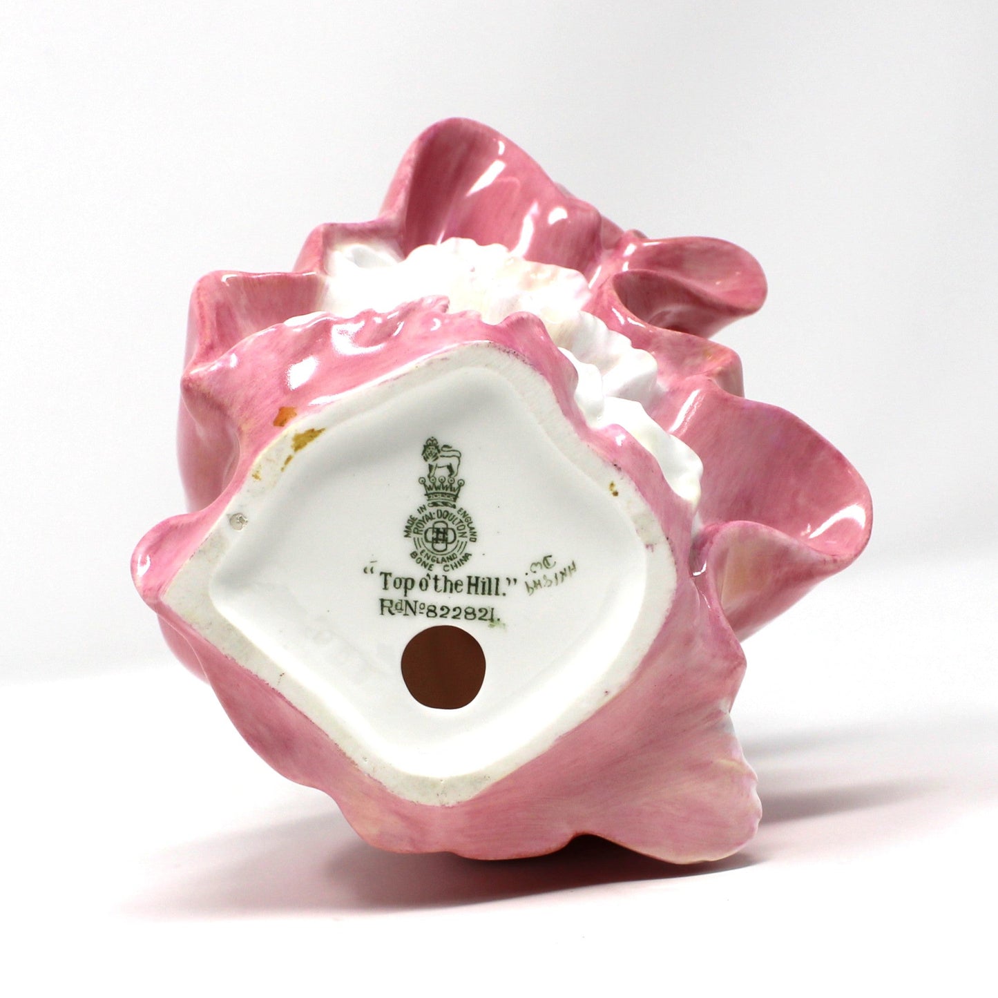 Bottom vase view with maker's mark on vintage porcelain Royal Doulton figurine titled "Top O' The Hill".  Bone China, England.