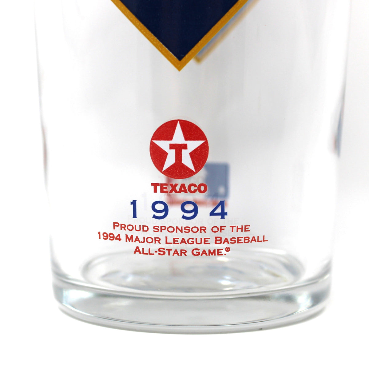 A clear glass tumbler featuring a red and blue Atlanta Braves 1994 Texaco All-Star Game logo