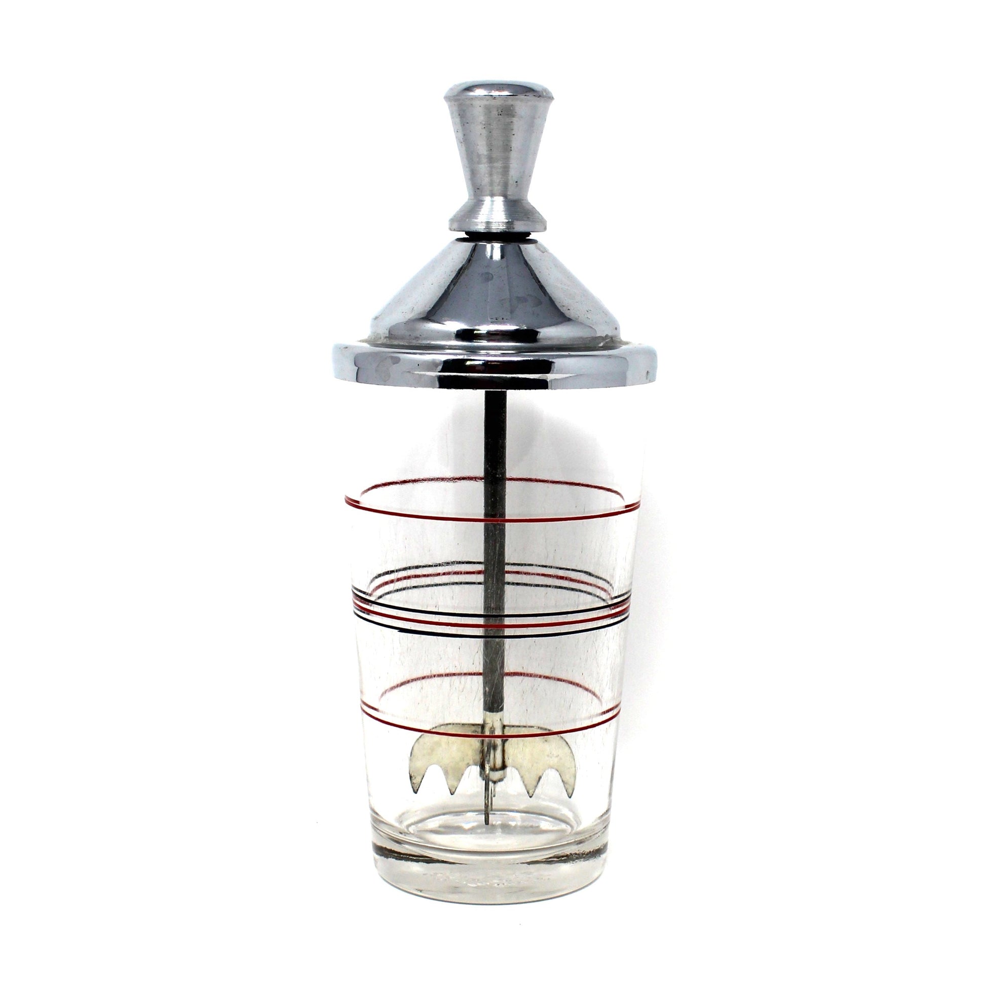 A vintage cocktail mixer / ice crusher.   A polished chrome metal top a clear glass body with red and black decorative rings. Lightning Ice Crusher by North Bros Mfg.