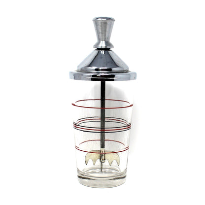 A vintage cocktail mixer / ice crusher.   A polished chrome metal top a clear glass body with red and black decorative rings. Lightning Ice Crusher by North Bros Mfg.