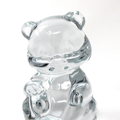 close up view of a vintage Fenton clear glass bear figurine / paperweight sitting upright.