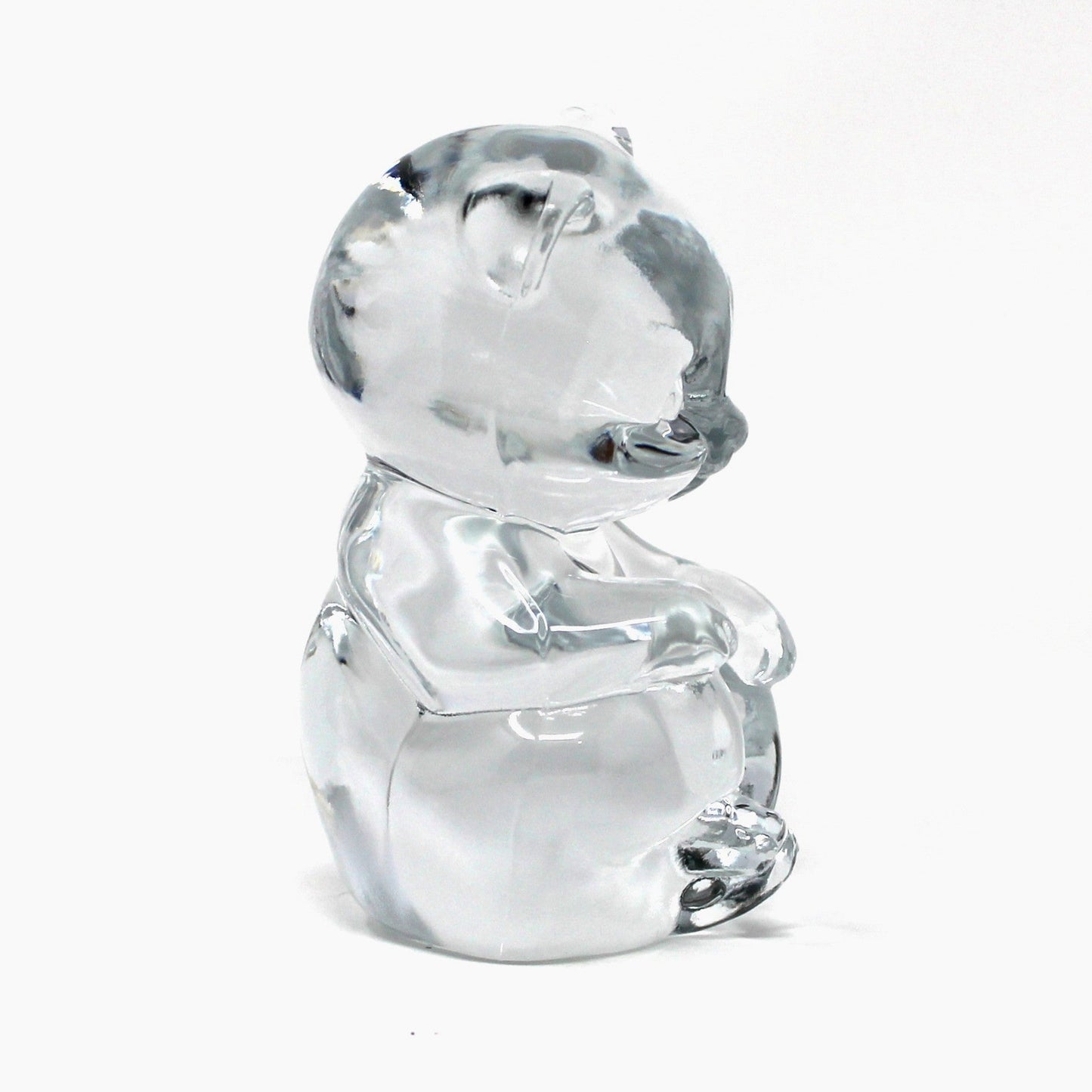 Side view of Fenton's vintage glass bear figurine / paperweight.  Clear glass and marked Fenton 9.  