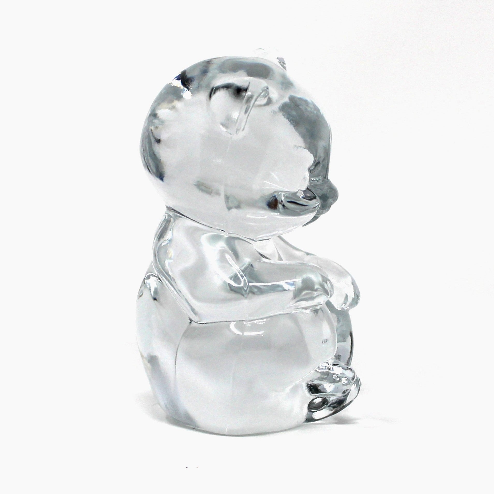 Side view of Fenton's vintage glass bear figurine / paperweight.  Clear glass and marked Fenton 9.  