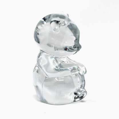 Side view of Fenton's vintage glass bear figurine / paperweight.  Clear glass and marked Fenton 9.  