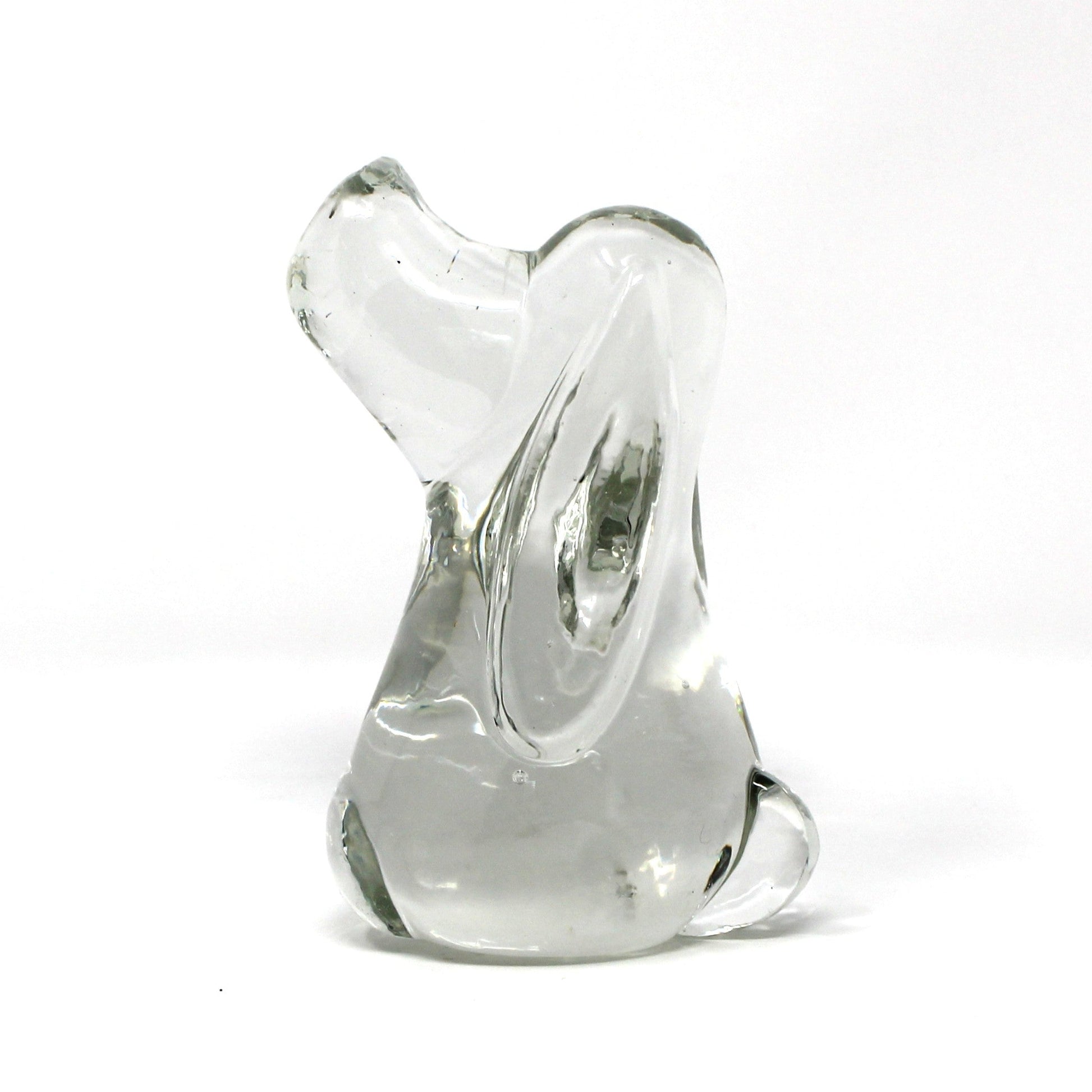 A small sculptural glass figurine, shaped like a Beagle or Hound Dog,  made of clear glass