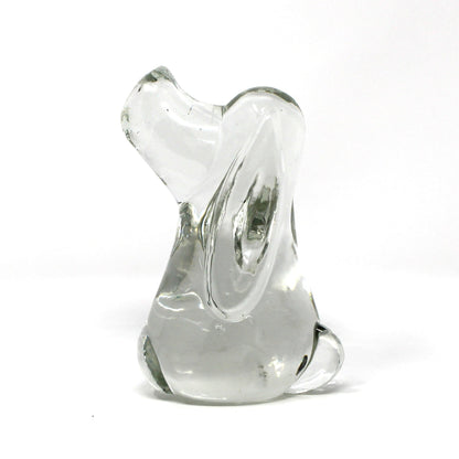 A small sculptural glass figurine, shaped like a Beagle or Hound Dog,  made of clear glass