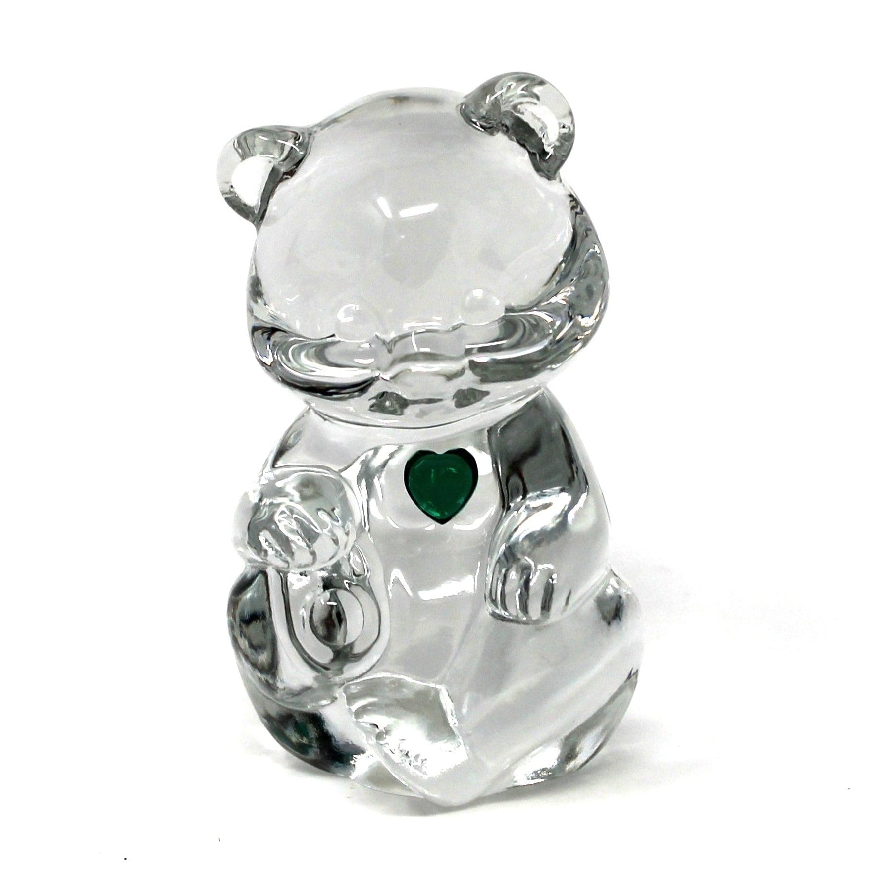 A small clear crystal bear charm with a green heart detail on its chest, shown against a plain white background.