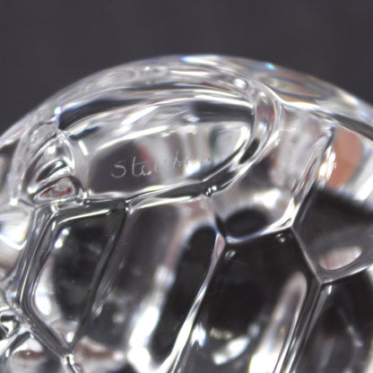 A close-up view of Steuben etched signature on crystal turtle
