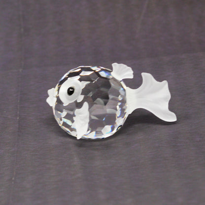 Side view of Swarovski medium size faceted crystal puffer fish figurine.